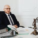 Bald Man Sitting Wearing Eyeglasses And Black Suit 7876289 150x150
